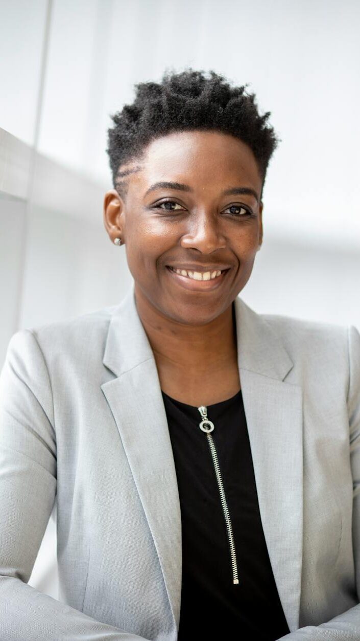 woman wearing gray notch lapel suit jacket